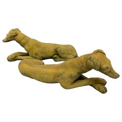 Pair cast stone recumbent whippets 