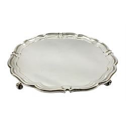 Silver circular salver with pie crust border on scroll feet D30cm London 1915 Maker Harrison Bros. and Howson  30.1oz