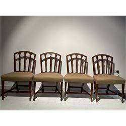 Set eight 19th century mahogany dining chairs, arched cresting rails above carved and fluted tapering splats with flower head motif, upholstered in contemporary geometric fabric, raised on square tapering supports with spade feet 