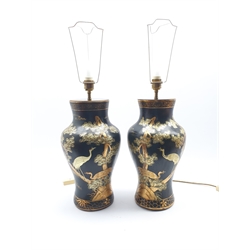 Pair of Black lacquer Chinoiserie table lamps of baluster form, decorated with scenes of deer and crane in a landscape, H45cm