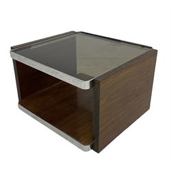 Contemporary coffee table, the smoked glass top over hardwood pot board base, raised on plastic castors 