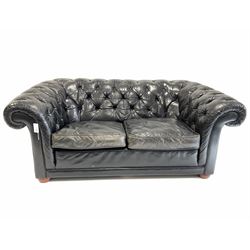 Tetrad Chesterfield two seat sofa, upholstered in deep buttoned black leather with squab cushions W165cm, H70cm, D100cm