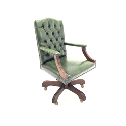  Modern mahogany open arm office chair, upholstered in deep buttoned green leather, moulded arm supports, swivel base, W62cm  