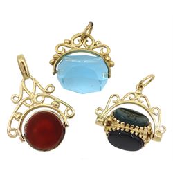 Three 9ct gold swivel fobs including black onyx, agate and bloodstone, onyx and carnelian and a blue stone, all hallmarked