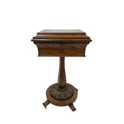 William IV rosewood teapoy or work box, cavetto moulded hinged lid revealing a cushion upholstered interior, the box on slender faceted vase shaped column, circular platform with lobe carved mounts, splayed feet with brass castors
