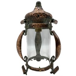 Arts & crafts copper hall lantern, of cylindrical form with pagoda style pierced top and scrolling strapwork frame, H25cm