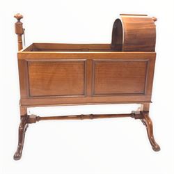 Victorian mahogany cradle on stand, the panelled crib with domed top section suspended from turned turned uprights united by double stretcher, raised on four splayed supports L115cm
