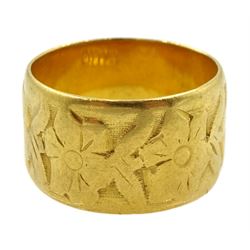 22ct gold wide wedding band with floral decoration, London 1967