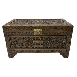 Oriental carved camphor wood blanket box with dragon, phoenix and foliate carvings 