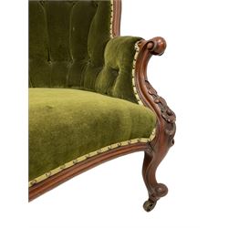 Victorian mahogany chaise longue, moulded shaped frame decorated with carved flower heads and extending foliage, upholstered in buttoned green fabric, shaped arms and cabriole supports with scroll carved terminals, on brass castors