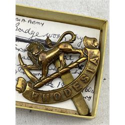 WW2 trench art table lighter bearing Polish Army cap badge, oak ships wheel form mirror with Rhodesia Castle inset plaque, Rhodesia badge, WW2 Polish bracelet and enamel badge and other related items