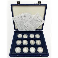 Twelve silver Alderney five pound coins, from the 'Victoria Cross Winners' silver coin collection, housed in a Westminster case, most with certificates