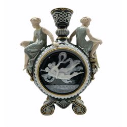 A Victorian George Jones Pate-sur-Pate moon flask decorated by Frederick Schenk, a maiden seated to the shoulder of each, impressed and numbered beneath 5648.. H36cm 