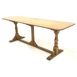 Early 20th century oak dining table, rectangular top raised on turned supports leading to sledge feet, 214cm x 70cm, H76cm
