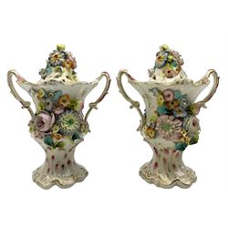 Pair of 19th century Coalbrookdale type pot pourri vases and covers, of twin handled baluster form, the covers and bodies encusted with flowers against a plain and pink ground, unmarked, H26cm 