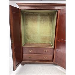 Edwardian mahogany wardrobe, the projecting cornice with chequered inlay, over one central glazed door, flanked by two doors with fan inlays, opening with interior fitted for hanging and with two drawers,  raised on bracket supports