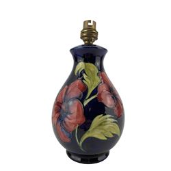 Moorcroft Hibiscus pattern table lamp, on blue ground, H21cm excluding fitting