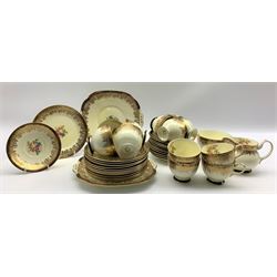 Collingwood Bros. tea set decorated with floral sprays within a blue and gilt border comprising twelve cups and saucers, twelve plates, two bread and butter plates, milk jug and sugar bowl (40)