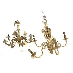 20th century five branch brass chandelier, the central support with three cherub heads and pineapple terminal, the five branches with decorated drip pans, H60cm, and a brass and onyx chandelier with eight scroll branches (2)
