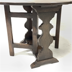 Small late 20th century occasional table, oval drop leaf top, gate action base, shaped end supports on sledge feet, 68cm x 61cm, H50cm