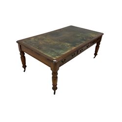 Late 19th century mahogany library writing or correspondence table, rectangular top with leather inset writing surface and moulded edge, fitted with three cockbeaded drawers to either side, raised on turned tapering supports terminating in brass and ceramic castors