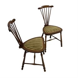 Pair late 19th to early 20th century walnut hall chairs, in the style of Josef Berka & Adolf Loos, shaped cresting rail with fan stick back, rounded triangular seat upholstered in striped fabric, raised on turned supports united by H-stretcher (2)
