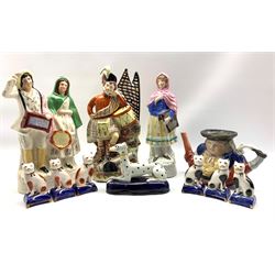 19th century Staffordshire pottery figure of musicians H33cm, two other standing figures, Toby tea pot, greyhound pen holder and six Staffordshire pottery cats