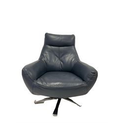 Swivel chair and footstool upholstered in blue leather, raised on a five spoke base 