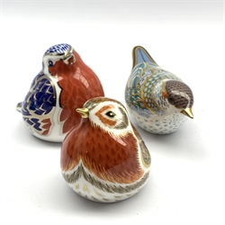 Royal Crown Derby 'Black Cap Warbler' paperweight, another 'Royal Robin' and another 'Platinum Robin', all boxed and with gold stoppers