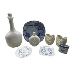 Two Royal Copenhagen porcelain pin dishes designed by Johannes Hedegaard no. 4449 & 4451, a Tranquebar toothpick holder, Stavangerflint plate, together with four pieces of plain ground porcelain comprising two vases, scent bottle and decanter (8)