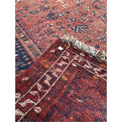 Hamadan rug of stylised floral design on a red field and bordered, (315cm x 204cm) and a washed Chinese hearth rug