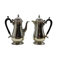 Silver coffee pot and matching hot water jug of baluster design with domed covers and ebonised handles H20cm Sheffield 1944 Maker Harrison Bros. & Howson 28.4oz gross 