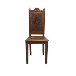  Oak  hall chair with carved panelled seat and back on square tapering supports