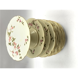 Deschamps Limoges dessert service painted with sprays of flowers on an ivory ground comprising tall comport, pair of low comports and twelve plates