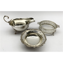 Georgian design silver sauce boat with C scroll handle Sheffield 1931 Maker Brook & Son, small silver circular pedestal dish of Art Nouveau design D10cm Birmingham 1955 and a glass butter dish in a key pattern silver frame   