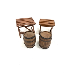 Pair of hardwood and iron bound barrels, (H44cm) and two slatted stained pine stools, (W60cm)