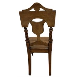 Victorian oak hall chair, the shield back carved and pierced with fan motifs with spiral turned pilasters, baluster turned supports with carved tulip decoration