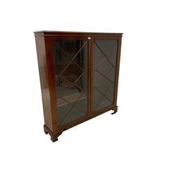 Late 19th century mahogany bookcase, two astragal glazed doors enclosing adjustable shelves raised on bracket supports 