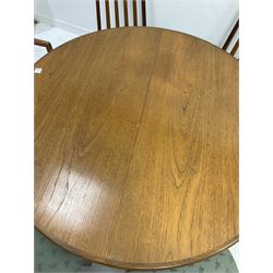 G-Plan teak circular extending dining table, folding leaf to centre, raised on turned supports () together with six G-Plan teak high back dining chairs with upholstered seats 