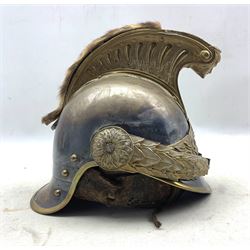 French Model 1874 Cuirassier helmet with steel skull, the brass comb embossed with beaded fluting and terminating with the head of Medusa, above a flaming grenade flanked by laurel leaves, with replacement plume and brown gilt embossed leather liner, H26cm