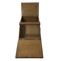 20th century carved oak workbox on stand, tapering rectangular form enclosed by two sloping hinged lids, decorated with curled acanthus leaf carved mounts, on square tapering supports 