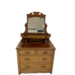 Edwardian mahogany dressing chest, top section fitted with two trinket drawers, rectangular top over two short and two long graduating drawers, raised on stile supports with shaped apron