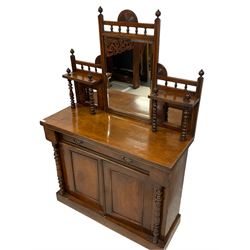 Late 19th century walnut chiffonier, mirror back with central bevelled plate flanked by two smaller square plates with shelves supported by turned columns, the rectangular top with reeded edge above singe drawer and two cupboards, turned pilister uprights connected to plinth base