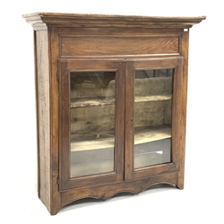 19th century French oak and walnut armoire, projecting cornice over to glazed doors enclosing two shelves, shaped apron, W157cm, H165cm, D50cm