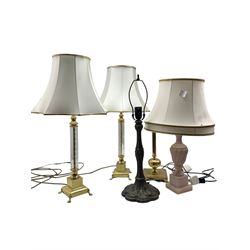 Pair of polished brass table lamps with glass stems, Tiffany style lamp base and two other lamps (5)
