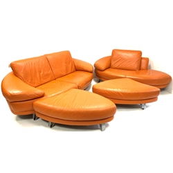 Contemporary Italian lounge suite, comprised of an orange leather two seat sofa, raised on brushed metal supports, (W228cm) with a matching chaise longue and two shaped footstools, retailed by Bohm of Manchester