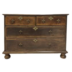 20th century mahogany chest of drawers, the projecting rectangular top over two short and two long oak lined drawers, raised on turned bun feet 