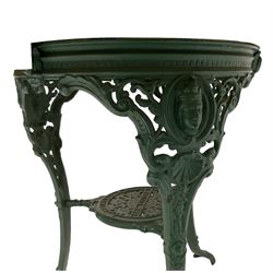 Circular kitchen table, waxed pine top, raised on painted cast iron Britannia style base, the cabriole supports pierced and decorated with scrolls and acanthus leaves, united by undertier 