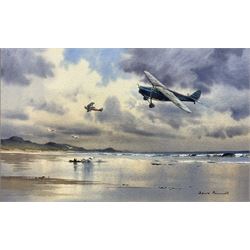 Denis Pannett (British 1939-): Vintage Propeller Planes Flying over Beach, watercolour signed 34cm x 53cm