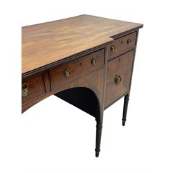 George III figured mahogany breakfront sideboard, the moulded top over five drawers and wide arched aperture, inlaid with satinwood and ebony stringing, foliate decorated brass plate handles, on turned supports